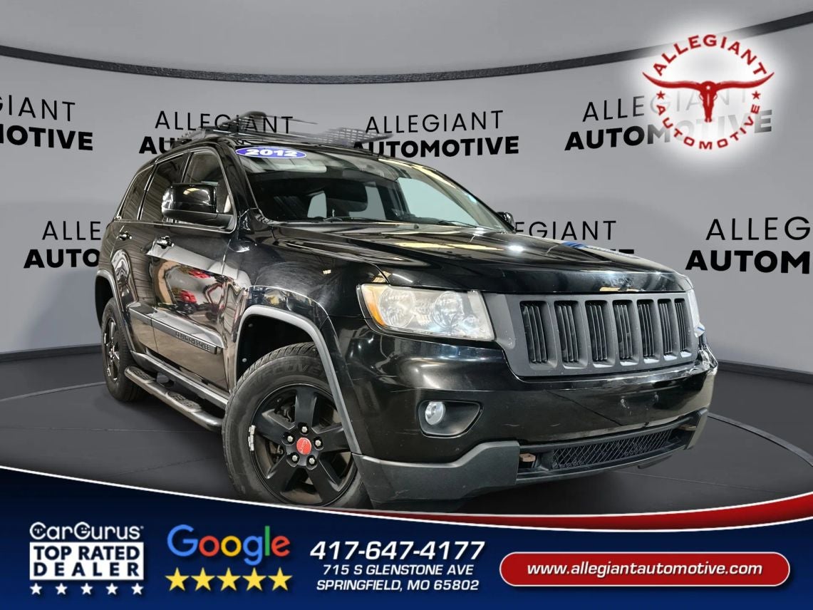 2012 Jeep Grand Cherokee Laredo Sport Utility 4D in Black — front three-quarter view