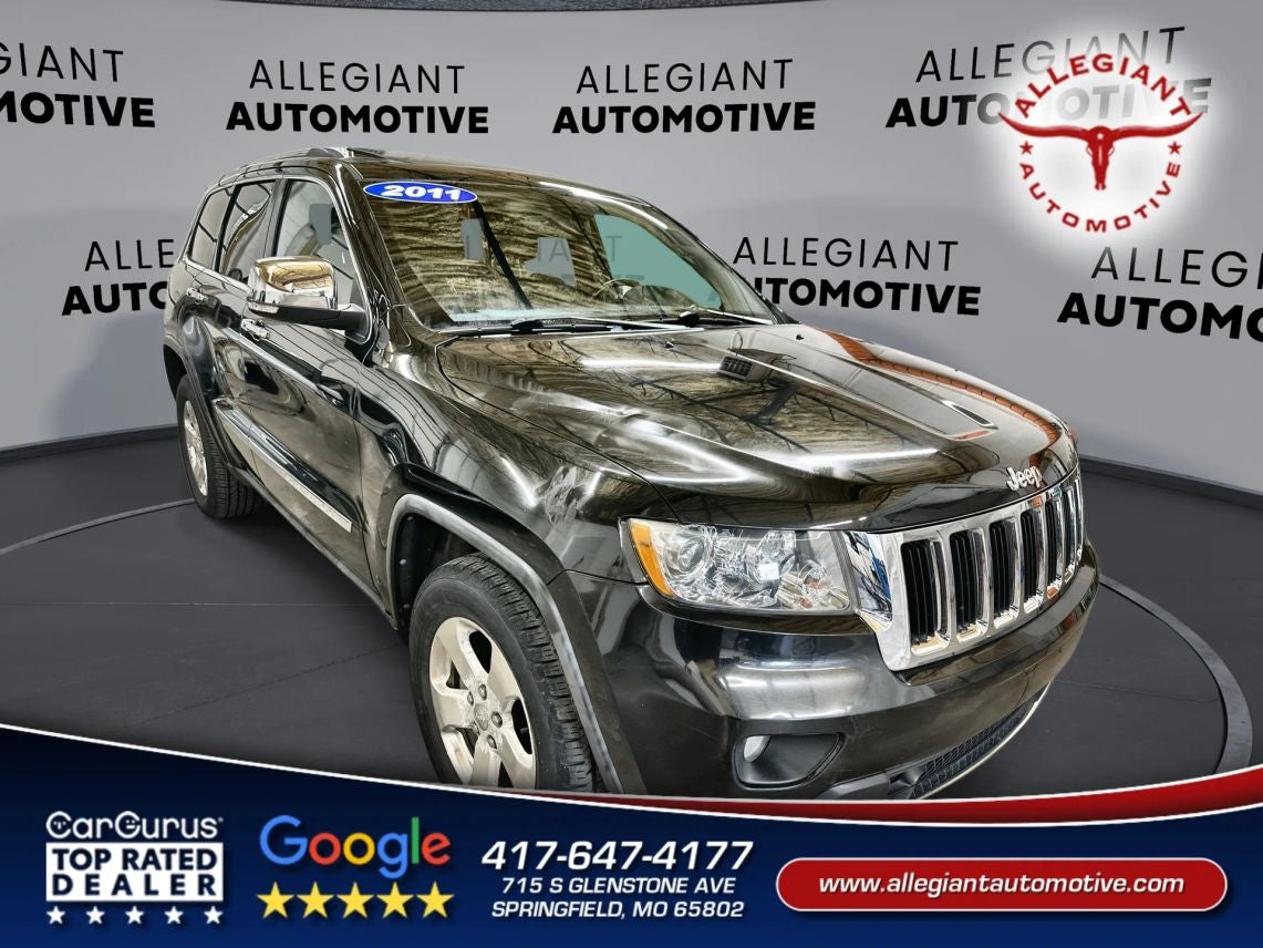 2011 Jeep Grand Cherokee Limited Sport Utility 4D in Black — front three-quarter view