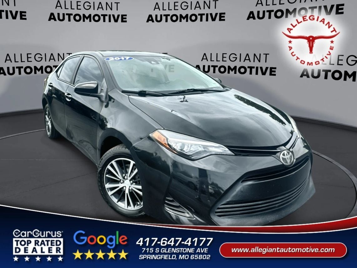2017 Toyota Corolla LE Sedan 4D in Black — front three-quarter view
