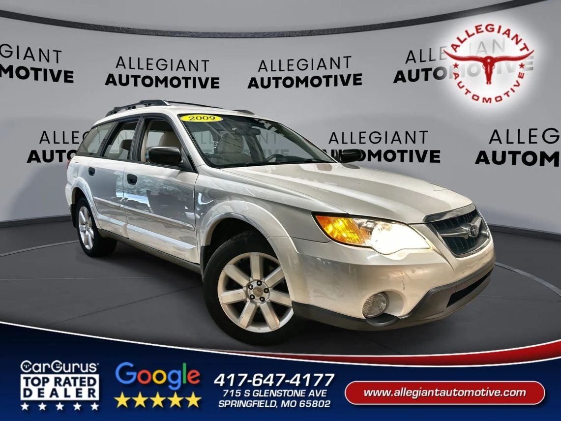 2009 Subaru Outback 2.5i Wagon 4D in White — front three-quarter view