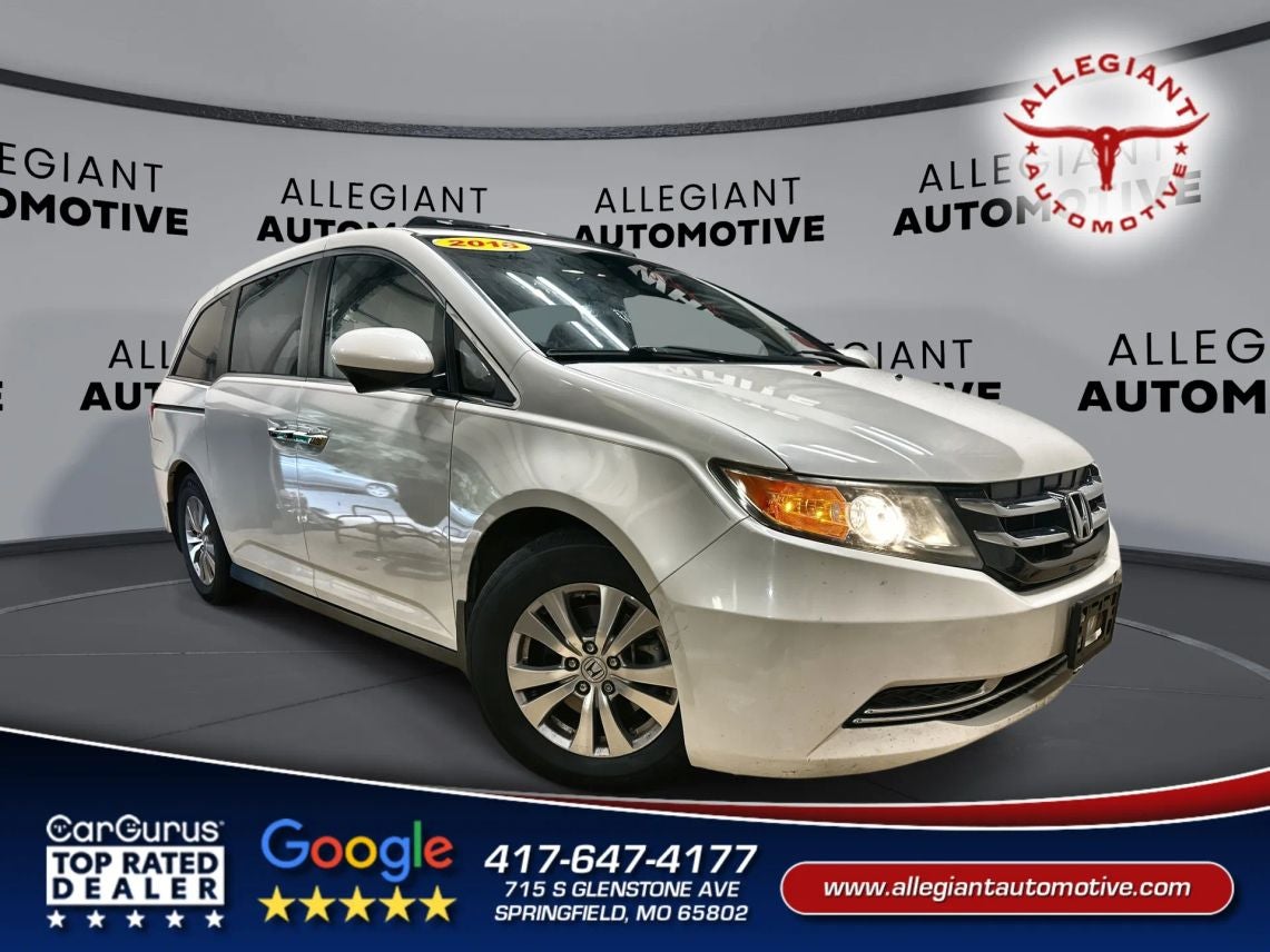 2016 Honda Odyssey EX-L Minivan 4D in White — front three-quarter view