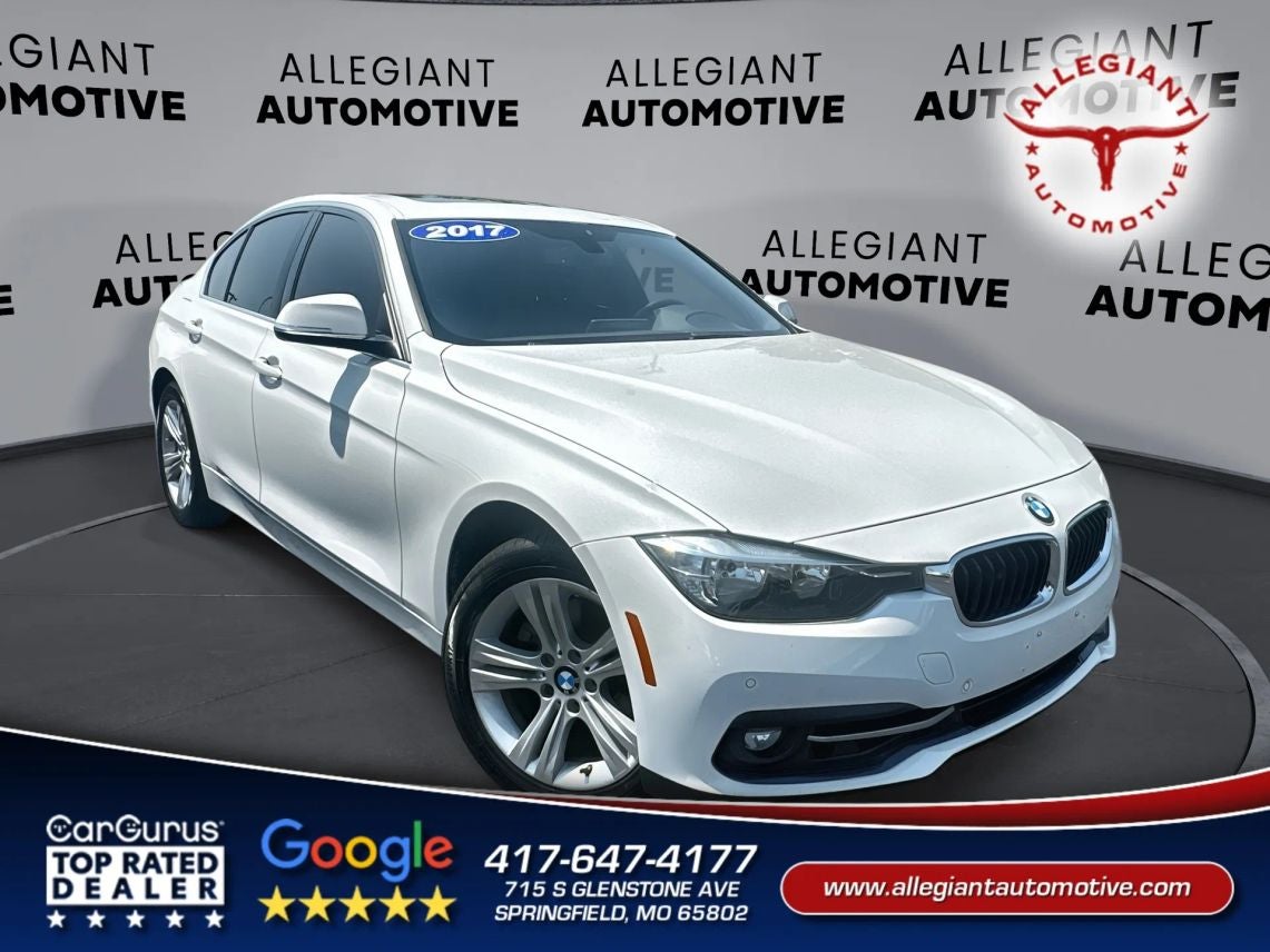 2017 BMW 3 Series 330i xDrive Sedan 4D in White — front three-quarter view